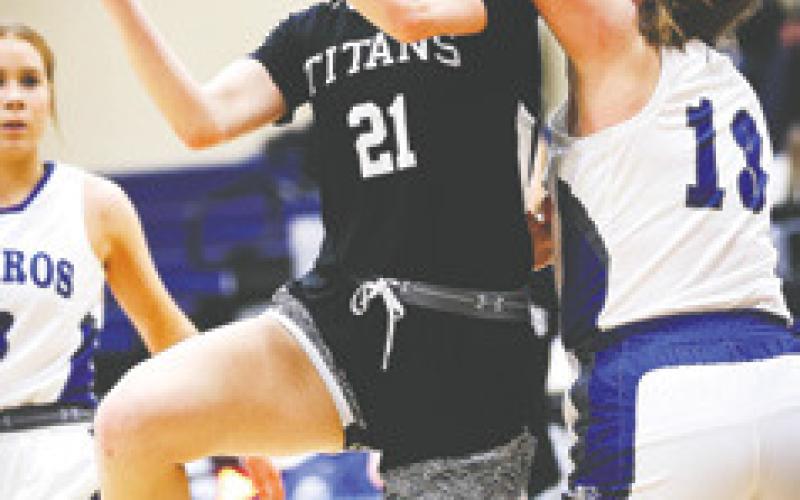 Freshman Elizabeth Fedje goes up for a basket defended by H-CV's Megan Ensign Friday. Photo courtesy of Corey Erickson, Hillsboro Banner.