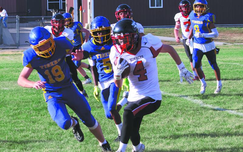 #4 Trypp Castillo sprints out of bounds to extend a Bomber drive. Photo by Jamie Rarick