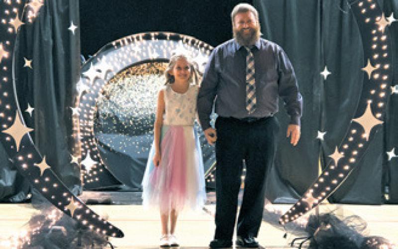 Ruth Rarick and her father Matt during the grand march. Photo by Lyle Van Camp.