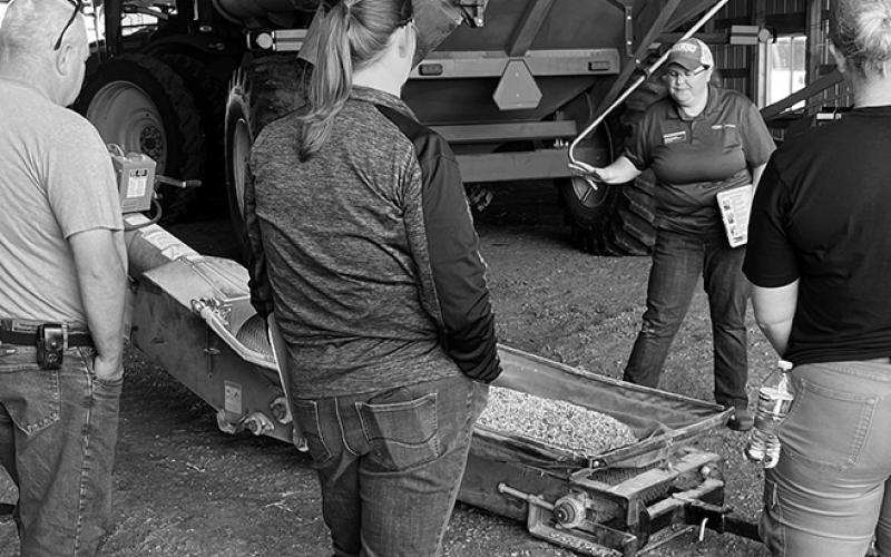 Angie Johnson, NDSU Extension farm and ranch safety specialist, explains safety procedures around an auger. (NDSU photo)