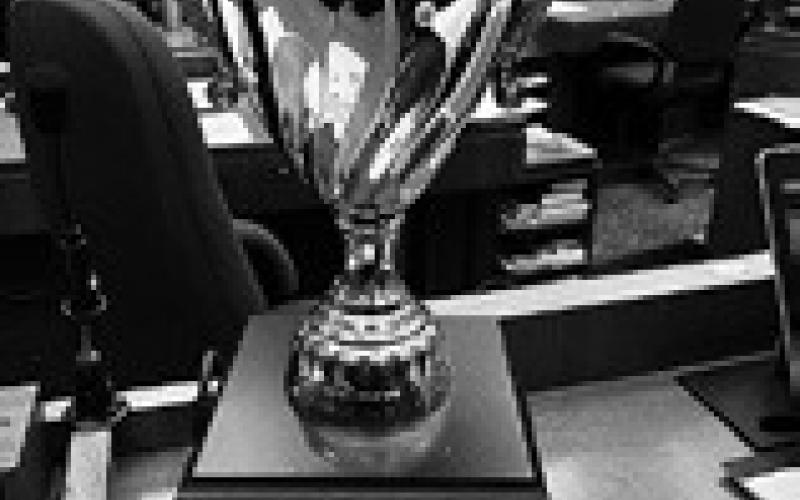 A trophy on the desk of Rep. Matthew Ruby, R-Minot, represents bragging rights for winning a bipartisan fantasy football league.