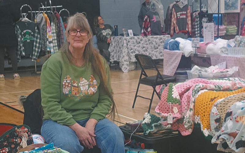 Elizabeth Wallace finds healing in creating her one-of-a-kind blankets. Pictured at Drayton's Old Fashioned Christmas vendor event. Photo by Christine Jensen