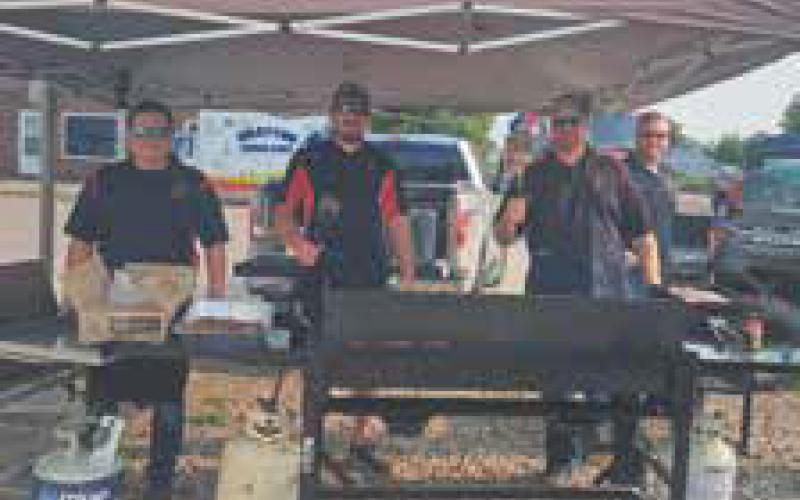 Jason Morris, Scott Halvorson, Jeremy Ganssle, and Travis Uggerud at the Firemens’ Burger Feed. Photo by Christine Jensen.