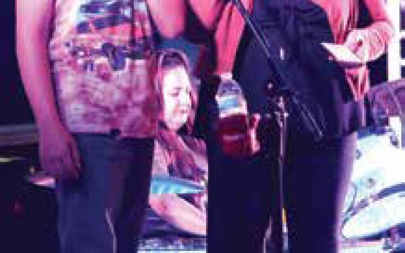 Ethan Sherrill got to sing with the band at the street dance. Photo by Lyle Van Camp.