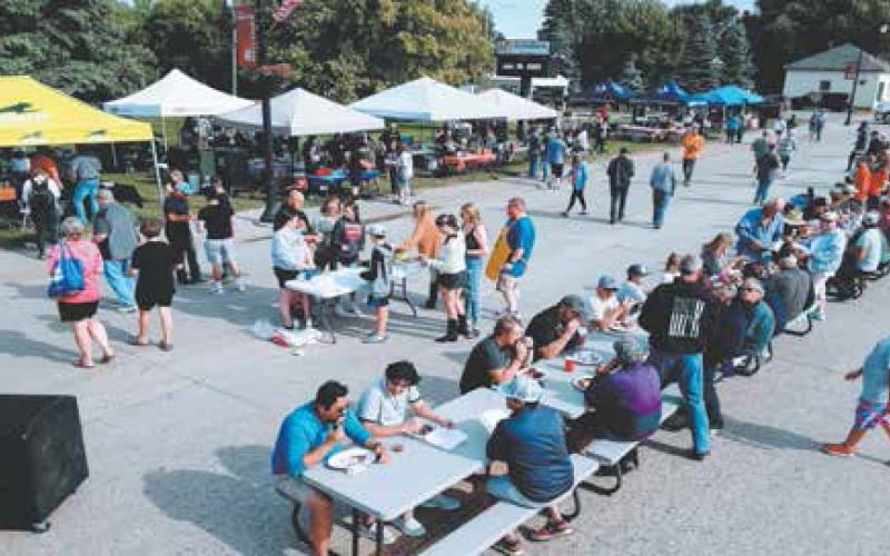 Locals and visitors lined up to eat and support the Drayton Volunteer Fire Department at Riverfest. Photo by Duane H.H. Lyon