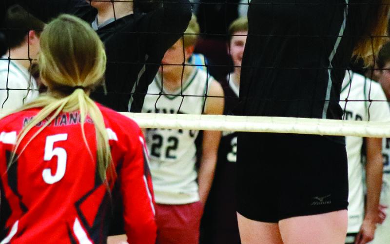 Madison Hermanson and Maria Myrdal go up for the block against the Mustangs in the Minto gym Monday night. VNV Photo by Lesa Van Camp
