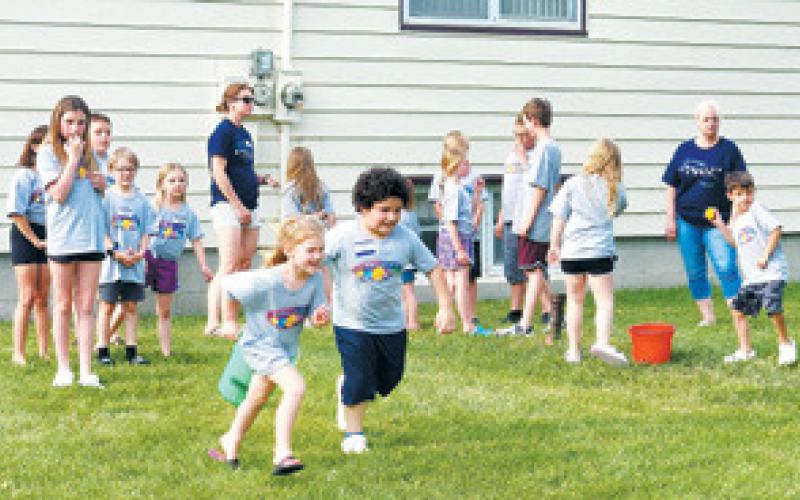 Children enjoyed outside games throughout VBS despite the heat. Photo by Hilary Nowatzki.