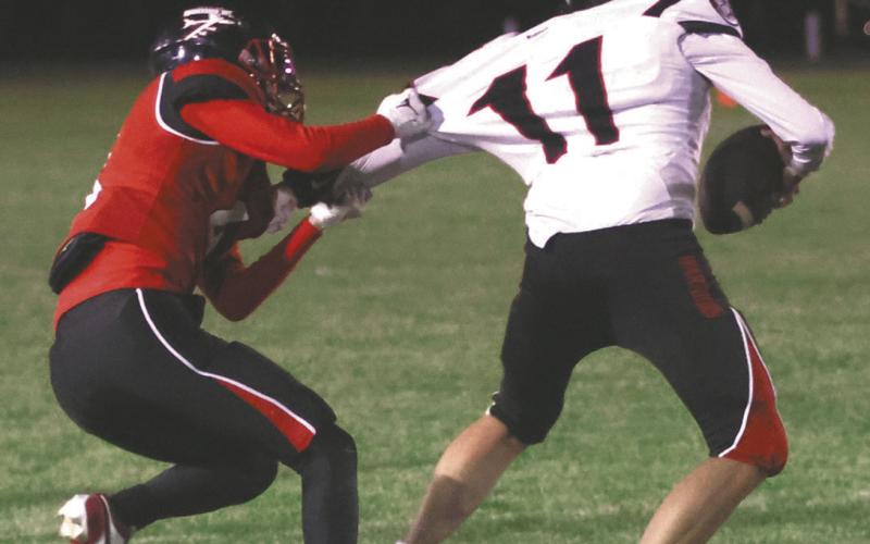 Trypp Castillo stops White Shield's Daceton Demarce late in the game. Photo by Lyle Van Camp