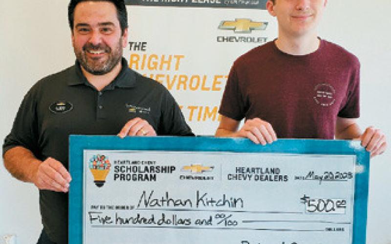 Al Berry presents a check for a $500 Scholarship to Nathan Kitchin of Langdon on behalf of Birchwood Chevrolet in Cavalier and Heartland Chevy Dealers. Nathan's application was chosen as the runner-up of all applications received.
