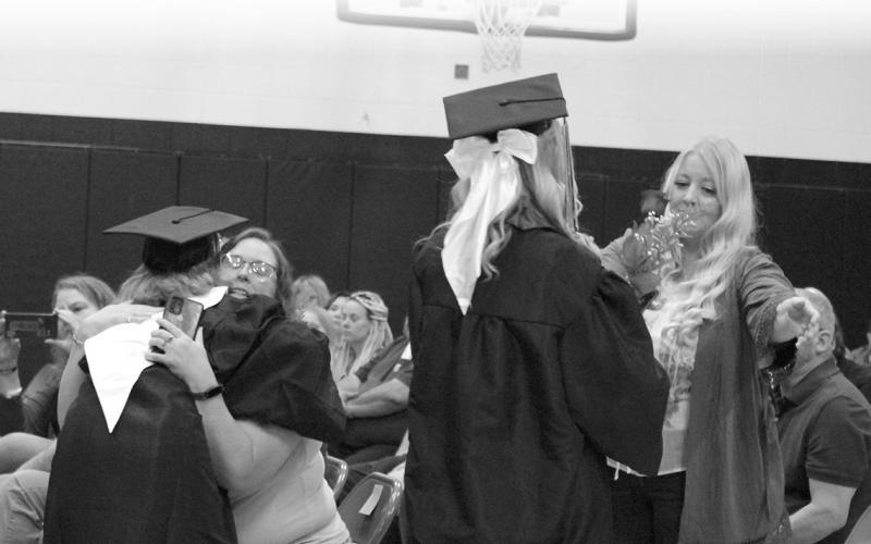 Siobhan Kissee and Emily Jerome thank their moms with hugs and flowers.