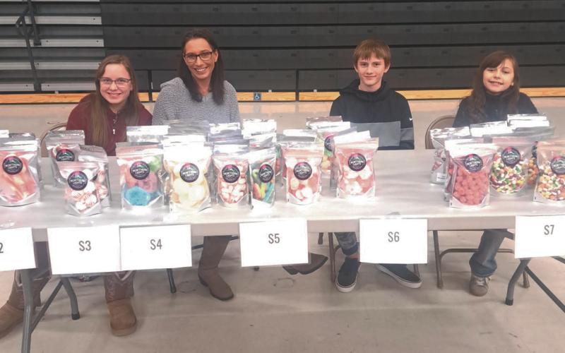 The Bromfields (left to right: Bailey, Lori, Barrett and Braylynn) sell their freeze dried creations at a local vendor event. Submitted photo