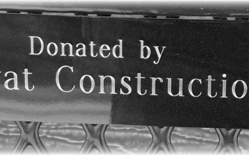 Donated benches are marked with a plaque. Photo by Christine Jensen