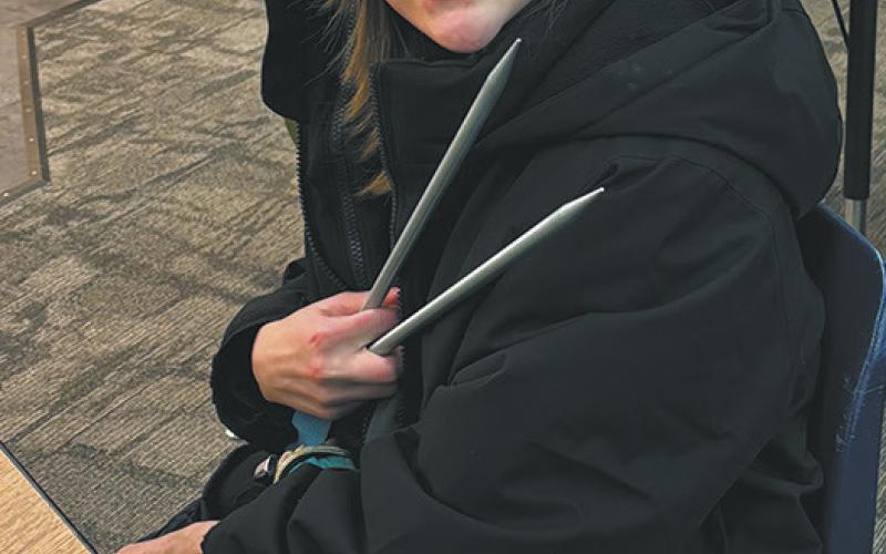 4th grader, DeeDee Manley showing off her knitting needles that were originally owned by her great grandmother. Photo by Andrea Johnston