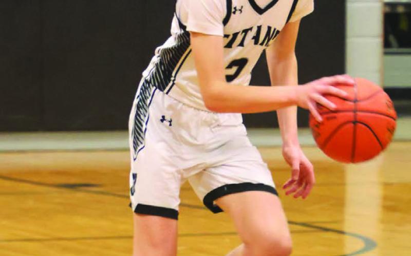 Quinn Passa brings the ball up the court against North Star.