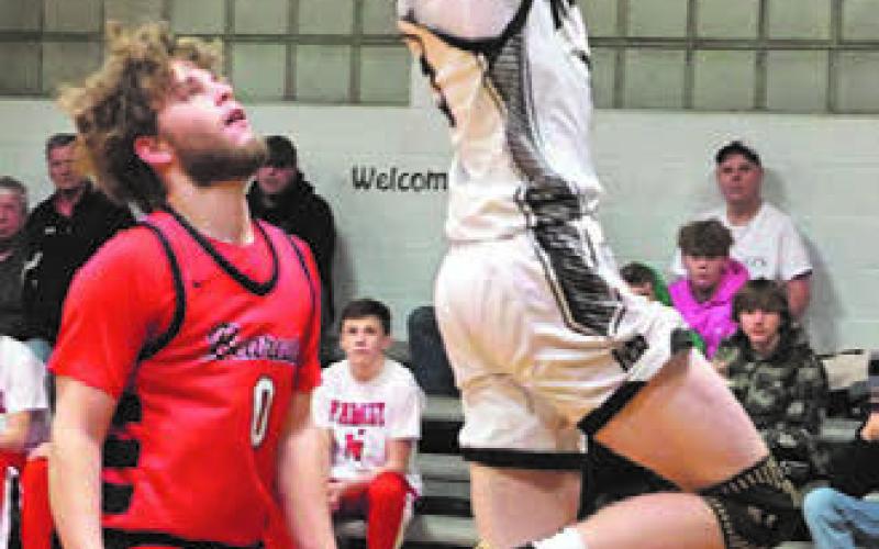 Connor Hurtt goes up on a two point attempt against North Star.