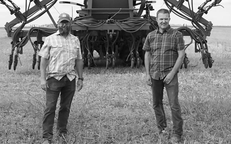 Chris Walberg (left) and Tyler Zimmerman, lifelong friends who have turned to regenerative agriculture together, were featured in a mini-documentary that’s been viewed nearly 600,000 times in the past six months. Photo provided by Kiss the Ground.