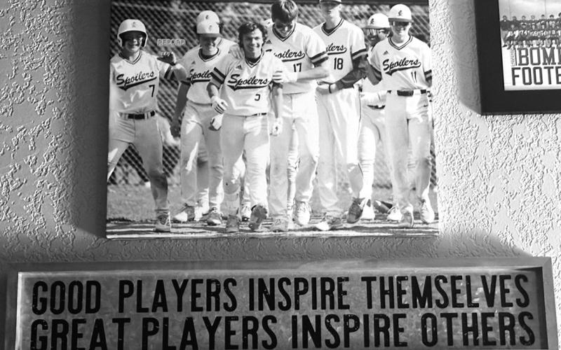 Hanging on the wall with many of his sports photos is this inspirational plaque that serves as a reminder of what participation in sports is all about. Submitted photo