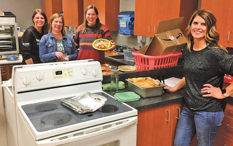 Pictured above Left to right: Track Moms serving supper: Natalie Feltman, Stacey Reilly, Naomi Myrdal and Sara Gullickson. Photo submitted