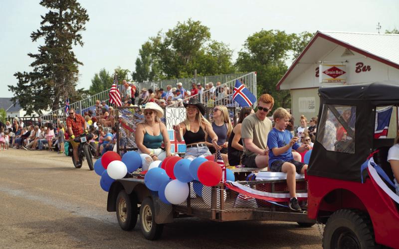 The Snorri Group, of which Julia Swanson was a part of, ride their float in the parade surrounded by massive crowds. Photo by Larry Stokke.