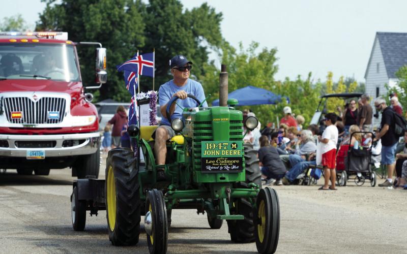 Lee Cudmore of Park River riding his 1947 restored John Deere tractor in the parade on Saturday. Photo by Larry Stokke.