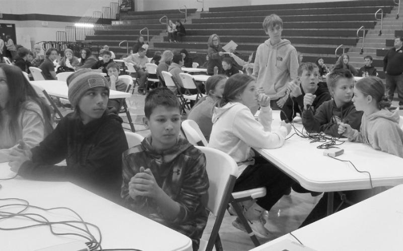 North Border Walhalla and Park River Area students thinking hard during lightning round practice question.