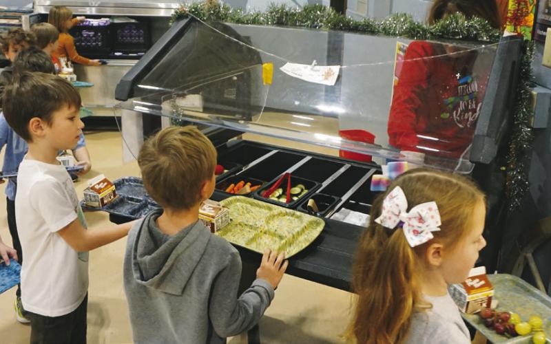 Kindergarten students at Roosevelt Elementary School in Bismarck line up for lunch on Dec. 9, 2022. Photo Michael Standaert.
