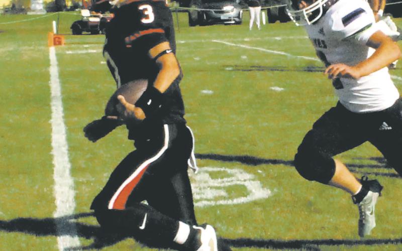 Trenten Keena crosses the goal line for the first touchdown of the game against Parshall. Photo by Jamie Rarick.