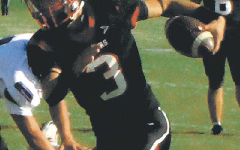 Trenten Keena breaks a tackle to extend the drive. Photo by Jamie Rarick.