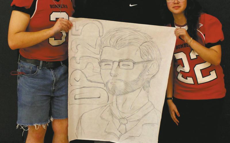 Junior class representatives Maddox Oihus and Allisson Chavez won Friday's homecoming drawing contest with their representation of DPS superintendent Jason Keating. Photo by Jamie Rarick.
