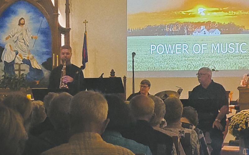 Andrew Danielson, Ian Petrerson and John Maxwell performing at “The Power of Music.” Photo by Christine Jensen