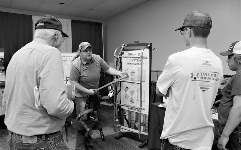 Angie Johnson, NDSU Extension farm and ranch safety coordinator, demonstrates grain bin safety equipment during the last year’s Big Iron farm show. (NDSU photo)