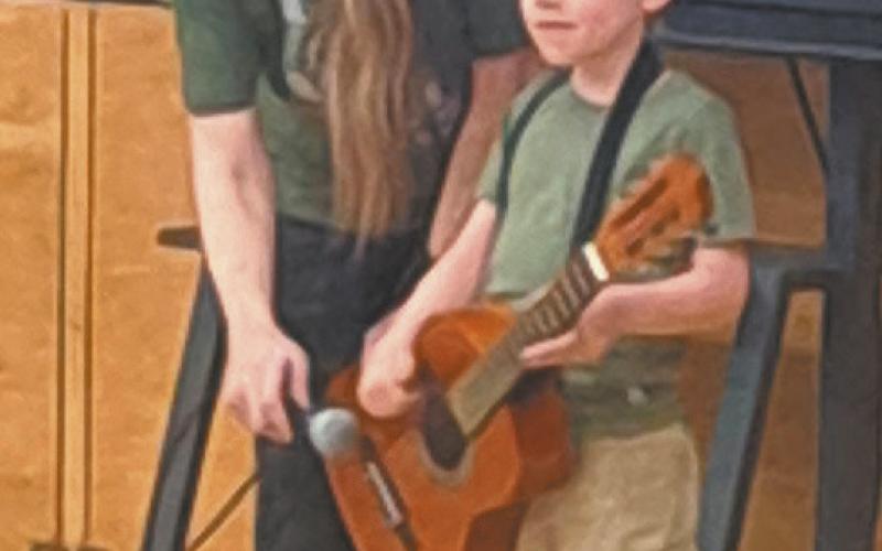 Mac Vold, son of Matt and Maggie Vold, was one of the young performers at the DPS talent show May 14. Photo by Christine Jensen
