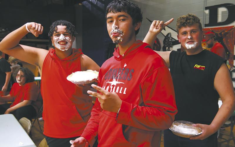 Jerimiah Johnson, Juan Navarro, and Ethan Lund following the pie eating competition. Photo by Jamie Rarick