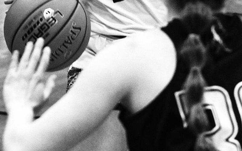 Aleah Pokrzywinski drives the ball down the court in a heated game Saturday. Photo by Mike Steinfeldt.