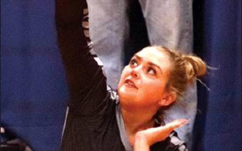 Aliyah Bartles serves against the Spoilers in the Crystal gym last week. VNV Photo by Lesa Van Camp