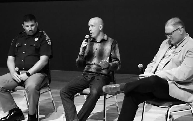 David Moore, center, general manager of Busy Bee’s Hot Oil Inc. in Williston, speaks next to Trooper Bennett Bitz, left, organizational development officer for the North Dakota Highway Patrol, and Jason Uhlir, right, safety manager for the Minnkota Power Cooperative, during the third annual Get Home Safe Day event at the North Dakota Heritage Center on June 1, 2026. (Photo by Michael Achterling/North Dakota Monitor)