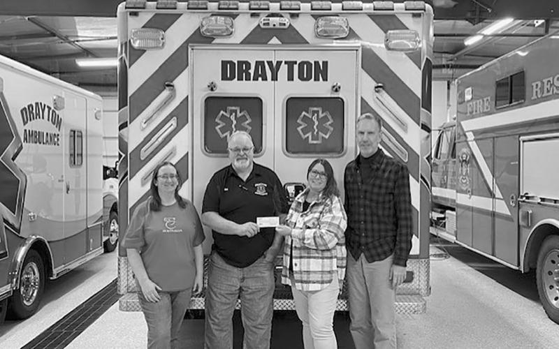 Becky Coffield PCMH Director recently presented checks to both the Drayton and Cavalier Ambulance Services for their portion of the Burgers &amp;amp; Bingo fundraisers held throughout Pembina County. Each squad received $2,640.75 Pictured L to R: Amber Green, Bill Tuttle, Becky Coffield, &amp;amp; Robbie Boll. Submitted photo
