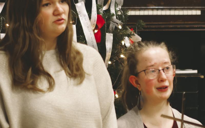 Alyson VanCamp and Siobhan Kissee played a flute duet and led a sing along Thursday evening. Photo by Lyle Van Camp.