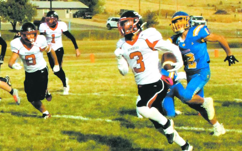 Trenten Keena outruns the Tiger defense to score another Bomber touchdown. Photo by Jamie Rarick.