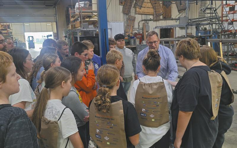 Seventh graders are shown how Bordertown Retail Systems produces custom racks for retailers at the Pembina-Walsh Manufacturing Day event. Submitted photo.