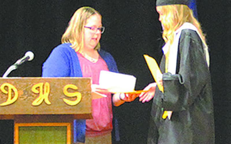Easton Larson earned the first ever Lyle Van Camp “Love Like Lyle” Memorial Scholarship for $500. Presented by Jamie Rarick. Photo by Andrea Johnston