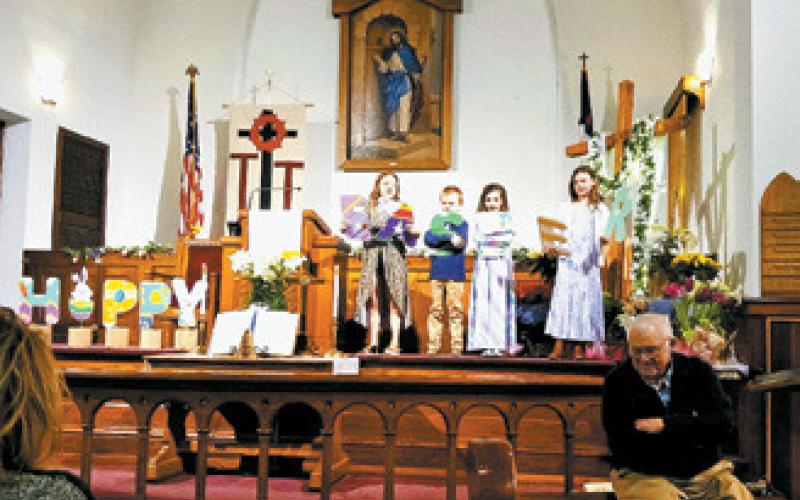 The youth at Drayton United Methodist Church sang unto the Lord continuing the celebration of Easter and the resurrection of Jesus Christ this past Sunday. Pastor Gary H. Johnson listened intently with a smile. A celebration meal was served after the service. Photo by Duane H.H. Lyon.