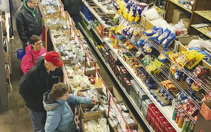 Shoppers peruse through a wide array of sweets. Photo by Larry Stoke.