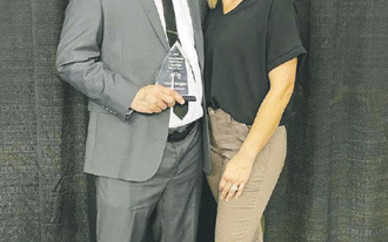 Pembina County North wrestling coach Shon Horgan was inducted into the North Dakota Wrestling Coaches Hall of Fame during the state wrestling tournament in Fargo. Horgan was voted into the hall of fame by his peers. The induction ceremony was held on Saturday, Feb. 18. Horgan is pictured with his wife, LaRae, following the ceremony. Submitted photo.