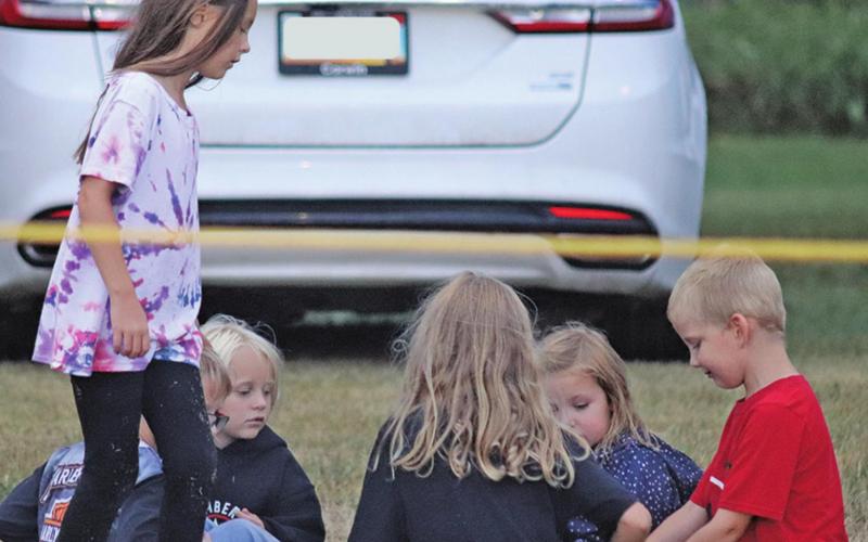 A group of youngsters play their own game of Duck, Duck, Goose during the football game Friday night. VNV photo by Lesa Van Camp