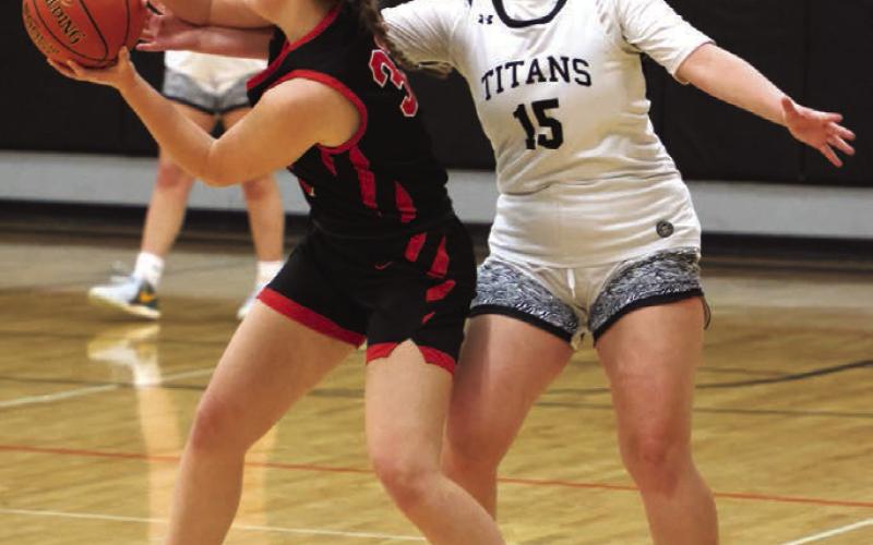 Aleah Pokrzywninski fights for control of the ball.
