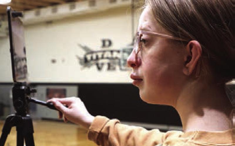 Siobhan Kissee keeps busy recording the games for the Titans.