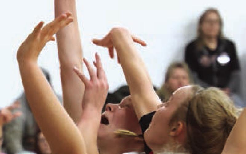 Easton Larson forces her shot past the Mustang's defense.
