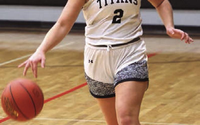 Brooke Gullickson brings the ball up the court.