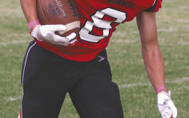 Carter Johnson picks up some yards for the Bombers. Photo by Lyle Van Camp